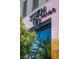 An outside view of the stylish Scottsdale Prime restaurant featuring lush greenery at 4381 W Flamingo Rd # 3002, Las Vegas, NV 89103