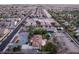 Real estate showcasing property with a pool, adjacent empty lot and mature trees in a quiet neighborhood at 4530 W Shelbourne Ave, Las Vegas, NV 89139