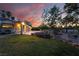 Spacious backyard features a large patio, mature trees, lush lawn and rock landscaping at 4530 W Shelbourne Ave, Las Vegas, NV 89139