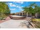 Expansive backyard features a large patio, mature trees and landscaping with brick accents at 4530 W Shelbourne Ave, Las Vegas, NV 89139
