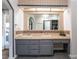 Spacious bathroom with double sinks, large mirror, and stylish tile accents at 4530 W Shelbourne Ave, Las Vegas, NV 89139