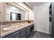 Bathroom featuring a double vanity with unique tiling and ample storage space at 4530 W Shelbourne Ave, Las Vegas, NV 89139