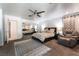 Cozy bedroom featuring a comfortable bed, mirrored closet doors, and neutral decor for a relaxing ambiance at 4530 W Shelbourne Ave, Las Vegas, NV 89139