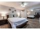 Bedroom featuring a queen-sized bed, matching nightstands, and a large, mirrored closet at 4530 W Shelbourne Ave, Las Vegas, NV 89139