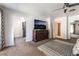 Bedroom featuring a dresser with a large-screen TV, and an open layout leading to additional rooms at 4530 W Shelbourne Ave, Las Vegas, NV 89139