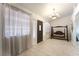 Bright entryway featuring tile floors, sheer curtains, and a decorative swing at 4530 W Shelbourne Ave, Las Vegas, NV 89139