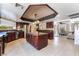 Spacious kitchen featuring cherry wood cabinetry, a large island, stainless steel appliances, and recessed lighting at 4530 W Shelbourne Ave, Las Vegas, NV 89139