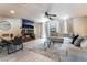 Cozy living room featuring a fireplace, comfortable seating, and an adjacent dining area at 4530 W Shelbourne Ave, Las Vegas, NV 89139