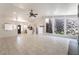 Spacious living room with plenty of natural light, high ceilings, and an adjacent rock wall at 4530 W Shelbourne Ave, Las Vegas, NV 89139