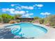 Sparkling pool surrounded by lush greenery, perfect for relaxation and entertainment at 4530 W Shelbourne Ave, Las Vegas, NV 89139