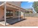 Backyard with a covered patio, gravel landscaping, and block wall at 5228 Shasta Lake Way, Las Vegas, NV 89118