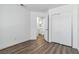 Bedroom with wood-look flooring, closet, and a doorway to the bathroom at 5228 Shasta Lake Way, Las Vegas, NV 89118