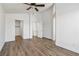 Empty bedroom featuring vaulted ceiling, luxury vinyl flooring and multiple doors at 5228 Shasta Lake Way, Las Vegas, NV 89118