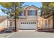 Charming two-story home with a two-car garage and well-maintained front yard at 5228 Shasta Lake Way, Las Vegas, NV 89118