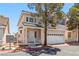 Inviting two-story home with a two-car garage and walkway to front door at 5228 Shasta Lake Way, Las Vegas, NV 89118