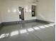 Spacious garage with durable epoxy flooring and an adjacent interior entrance at 5228 Shasta Lake Way, Las Vegas, NV 89118