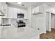 Bright kitchen with white cabinets, quartz countertops, and stainless steel appliances at 5228 Shasta Lake Way, Las Vegas, NV 89118