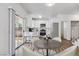 Eat-in kitchen area featuring white cabinets, stainless appliances, and outdoor access at 5228 Shasta Lake Way, Las Vegas, NV 89118