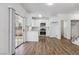 Modern kitchen with white cabinetry, stainless steel appliances, and hardwood flooring at 5228 Shasta Lake Way, Las Vegas, NV 89118