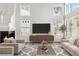 Bright living room with a fireplace, plush seating, and an entertainment center with updated flooring at 5228 Shasta Lake Way, Las Vegas, NV 89118