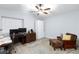 Comfortable bedroom featuring a ceiling fan and a nice area rug at 5601 Cavalier Cir, Las Vegas, NV 89130