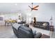 Open-concept living area with a modern kitchen, comfortable seating, and ample space for relaxation and entertaining at 5601 Cavalier Cir, Las Vegas, NV 89130