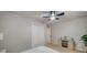 This comfortable bedroom is well-lit with laminate floors, a modern ceiling fan, and a large closet at 700 Cactus Ln, Las Vegas, NV 89107
