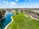 Beautiful aerial view of a well-maintained golf course and a serene lake within a residential community at 7241 Indian Creek Ln # 203, Las Vegas, NV 89149