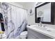 Bathroom with marble shower curtain, modern fixtures, and decor at 7241 Indian Creek Ln # 203, Las Vegas, NV 89149