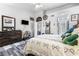 Bright bedroom with neutral colors, decorative ladder, and modern wood-look flooring and dresser at 7241 Indian Creek Ln # 203, Las Vegas, NV 89149