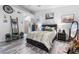 Stylish bedroom featuring wood-look flooring, rustic furniture, and Southwestern-inspired decor at 7241 Indian Creek Ln # 203, Las Vegas, NV 89149