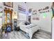 Stylish bedroom featuring decor, a comfortable bed, and decorative shelving at 7241 Indian Creek Ln # 203, Las Vegas, NV 89149