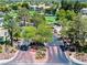 Elegant gated entry to a beautiful community with lush landscaping and mature trees and access to golf course at 7241 Indian Creek Ln # 203, Las Vegas, NV 89149
