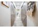 Hallway with barn-style sliding doors and stylish wood-look flooring at 7241 Indian Creek Ln # 203, Las Vegas, NV 89149