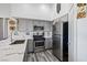 Modern kitchen features stainless steel appliances, sleek gray cabinets, and white marble countertops at 7241 Indian Creek Ln # 203, Las Vegas, NV 89149