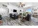 Spacious living room with a fireplace, vaulted ceiling, and view of the balcony at 7241 Indian Creek Ln # 203, Las Vegas, NV 89149