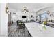 Bright living room with a breakfast bar area features a cozy fireplace and ample seating at 7241 Indian Creek Ln # 203, Las Vegas, NV 89149