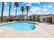 Community pool area with lounge chairs and well maintained landscaping in a desert environment at 7241 Indian Creek Ln # 203, Las Vegas, NV 89149