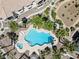 Aerial shot of a private community pool with surrounding palm trees and lounge chairs at 7241 Indian Creek Ln # 203, Las Vegas, NV 89149