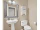 Neutral powder room features a sleek sink and fixtures at 7437 Treasure Chest St, Las Vegas, NV 89139