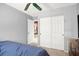 A bedroom with sliding closet doors, neutral walls, and carpet flooring at 7437 Treasure Chest St, Las Vegas, NV 89139