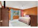 Comfortable bedroom with a ceiling fan and a large window providing ample natural light at 7437 Treasure Chest St, Las Vegas, NV 89139