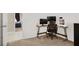 A view from the doorway into a bedroom featuring modern desk with computer setup at 7437 Treasure Chest St, Las Vegas, NV 89139