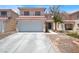 Two-story home featuring a red tile roof and a two-car garage at 7437 Treasure Chest St, Las Vegas, NV 89139