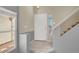 Inviting foyer with tile floors, staircase, and natural light at 7437 Treasure Chest St, Las Vegas, NV 89139
