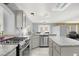 Bright kitchen with stainless steel appliances and granite countertops, perfect for cooking and entertaining at 7437 Treasure Chest St, Las Vegas, NV 89139