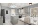 Sunlit kitchen featuring granite countertops, stainless steel appliances, and a functional kitchen island at 7437 Treasure Chest St, Las Vegas, NV 89139