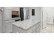 Updated kitchen featuring stainless steel appliances, granite countertops, and a functional center island at 7437 Treasure Chest St, Las Vegas, NV 89139