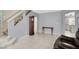 Open concept living area with tile floors and neutral paint at 7437 Treasure Chest St, Las Vegas, NV 89139