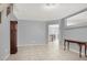 Spacious living area featuring neutral paint, tile flooring, and open floor plan at 7437 Treasure Chest St, Las Vegas, NV 89139